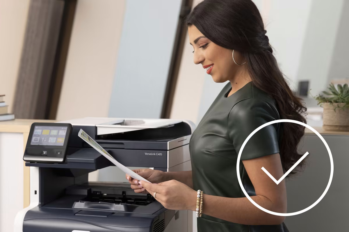 woman-reading-print-copy-from-printer-1200x800